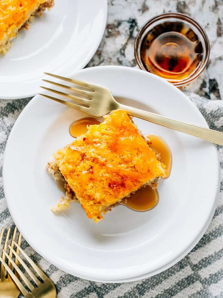 Top view of this delicious breakfast bake with sausage, pancake, cheese, and syrup!