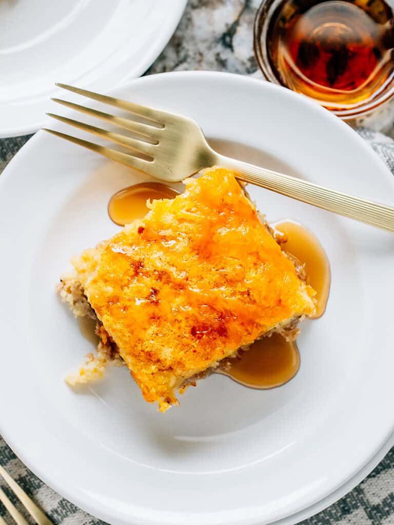 Top view of this delicious breakfast bake with sausage, pancake, cheese, and syrup!