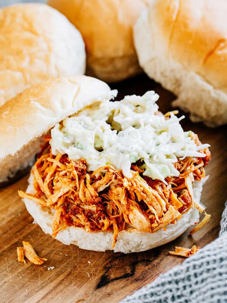 A hot honey chicken sandwich with pickle slaw and a homemade bun is the perfect combination of heat and sweet.
