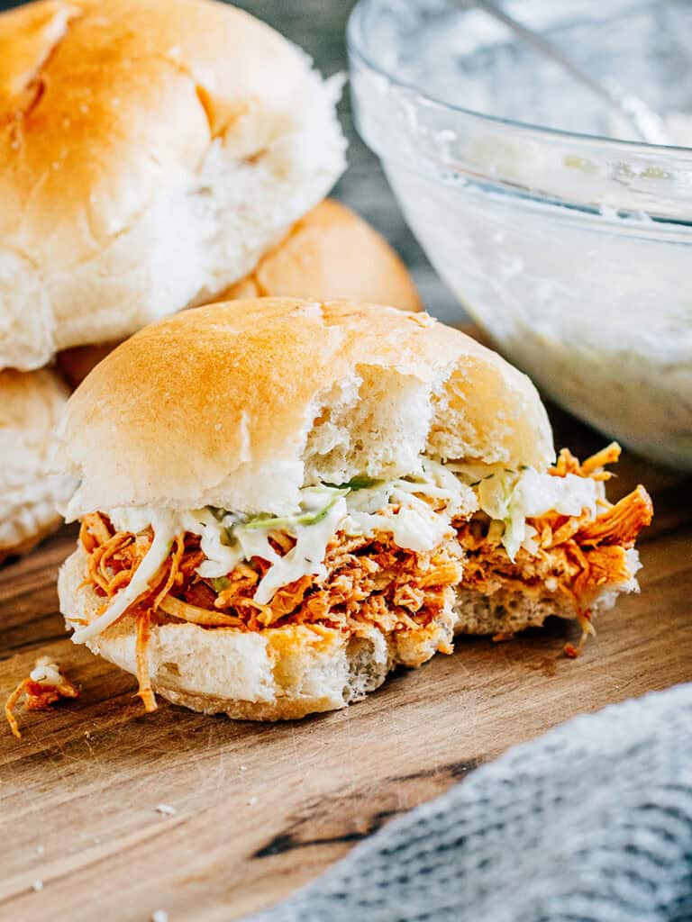 A hot honey chicken sandwich with bites taken out. This is a great easy sandwich recipe!