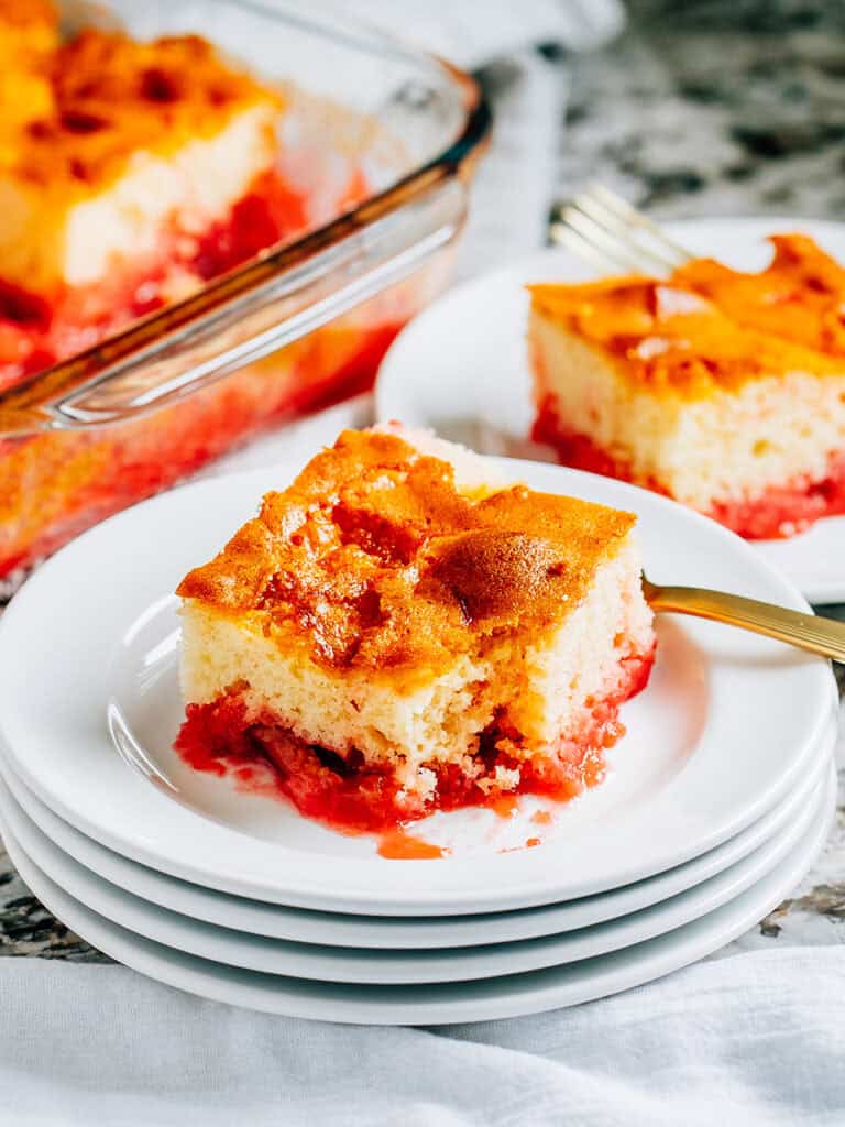 Slices of white cake with rhubarb and jello ready to be served.