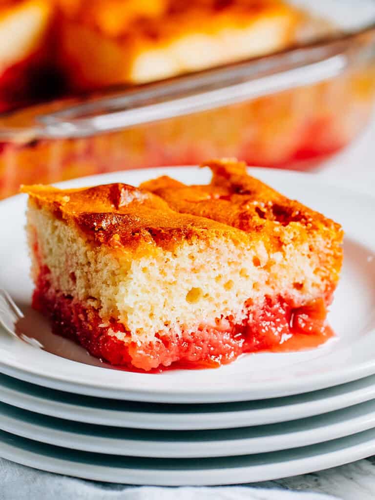 A piece of rhubarb cake made with mini marshmallows and strawberry jello.
