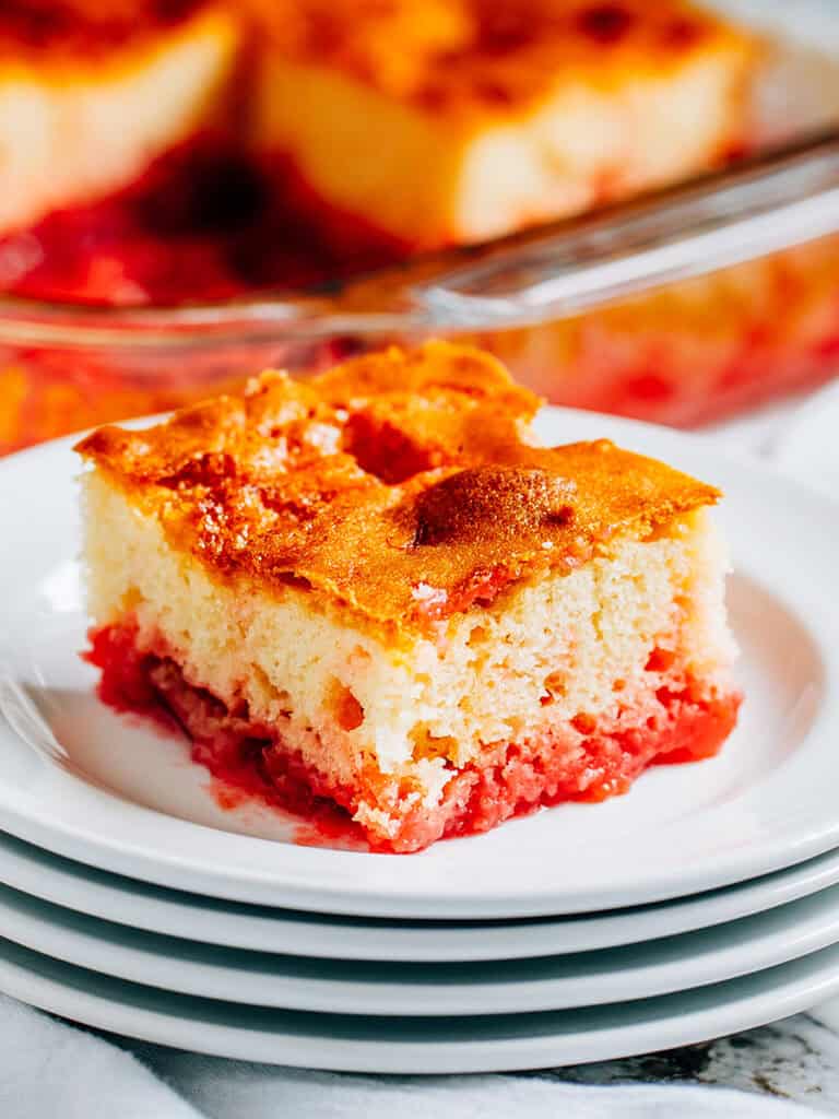 A piece of rhubarb cake made with mini marshmallows and strawberry jello.