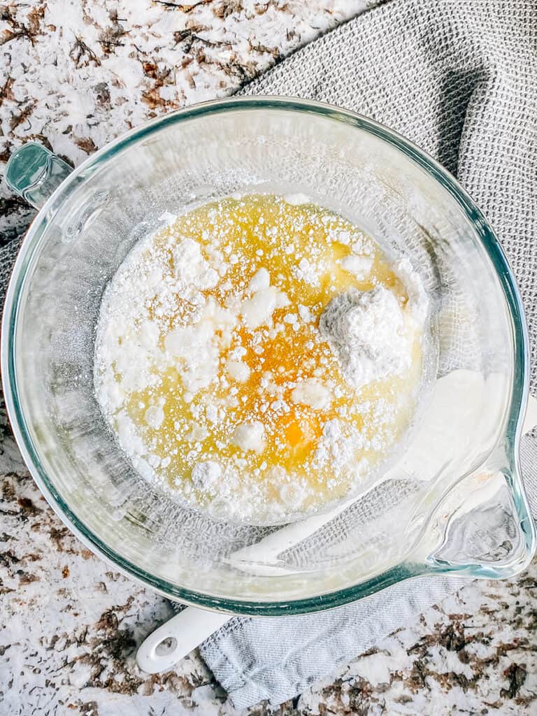 The white cake mix, eggs, oil, and water(per the box directions) in a mixing bowl.