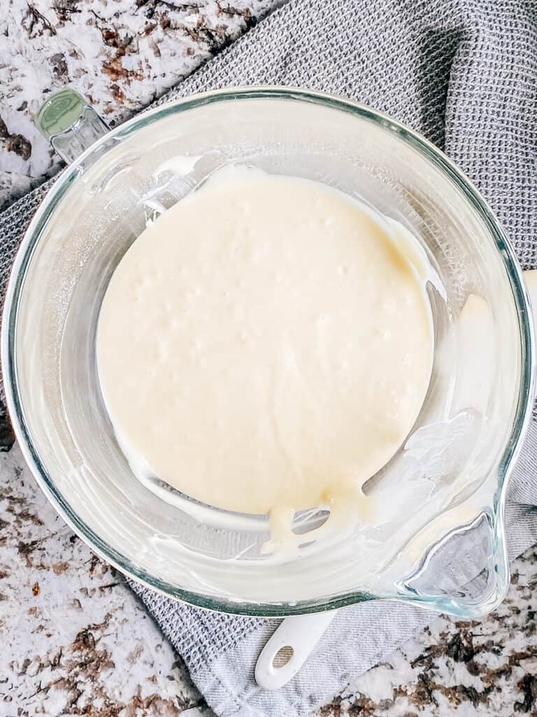 The white cake batter completely mixed.