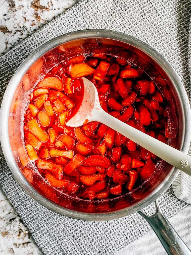 The strawberry jello mixed into the cooked rhubarb syrup.