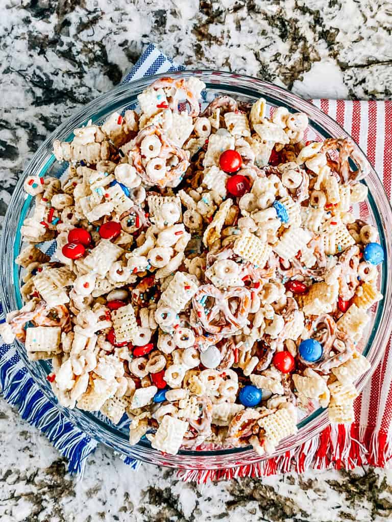 This white chocolate trail mix with red, white, and blue M&Ms and sprinkles. An easy 4th of July snack for parties!