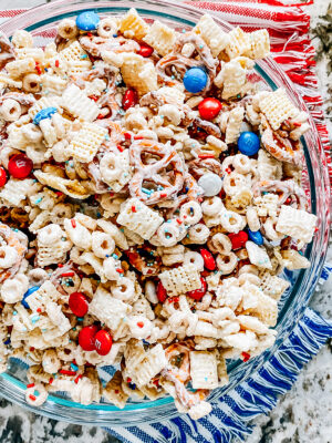 Red, white, and blue themed white chocolate covered pretzels and cereals for a great 4th of July party snack