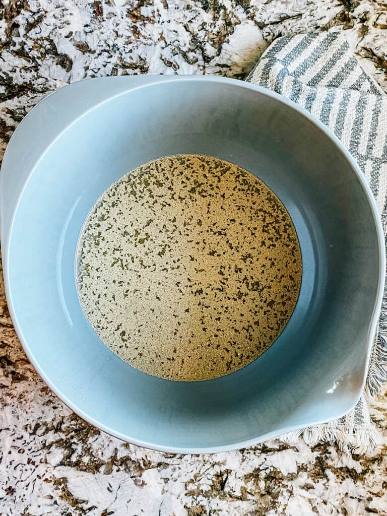 Yeast and sugar on top of warm water in a medium to large bowl.