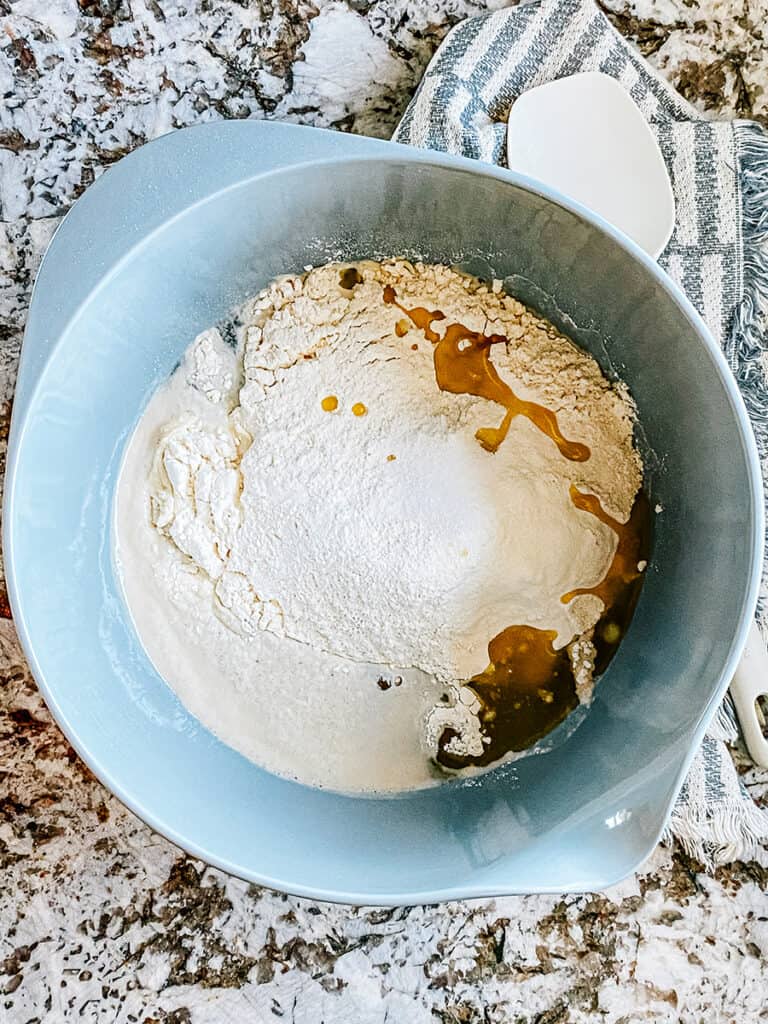 Flour, oil, and salt add to the yeast water.