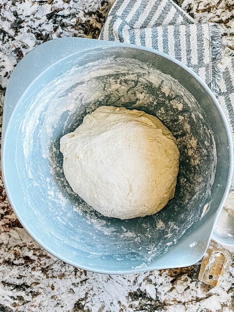 Complete English muffin dough thats been kneaded and flour added until smooth and not sticky.