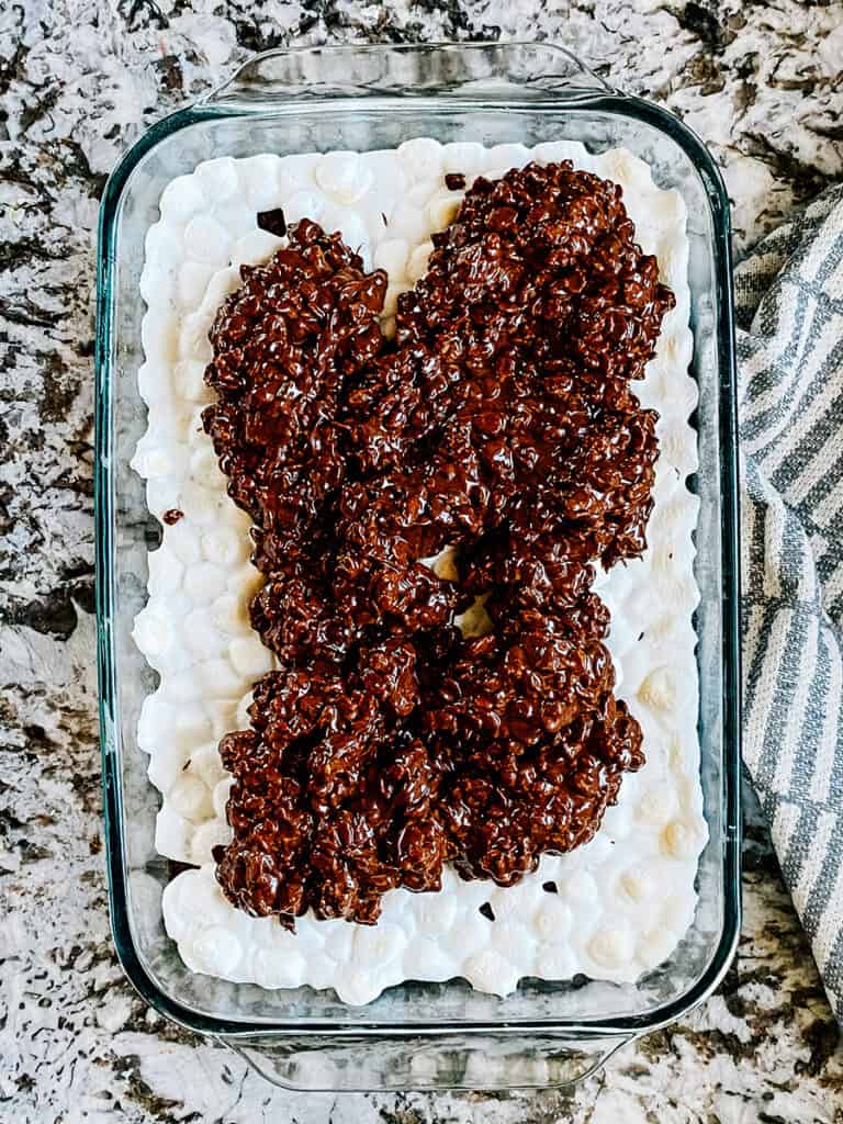 The peanut butter chocolate rice Krispies dolloped on top of the completely cooled marshmallow topped brownies.
