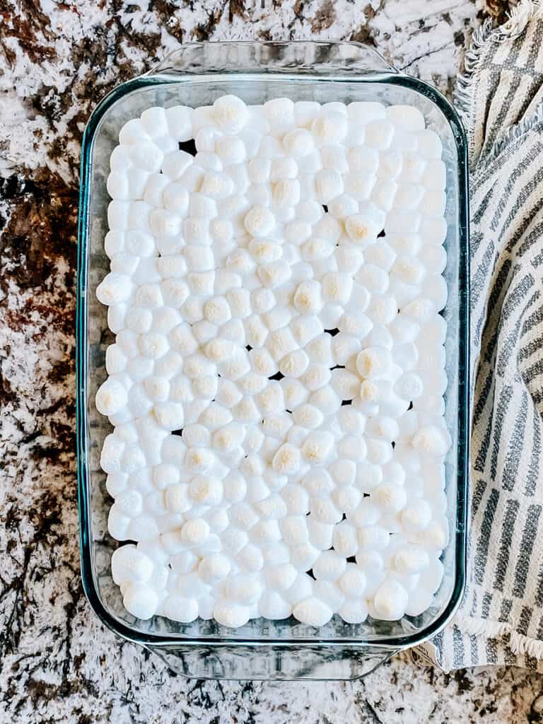 Mini marshmallows melted on top of a pan of brownies by baking them with the brownies for 2 minutes in a 350°F oven.