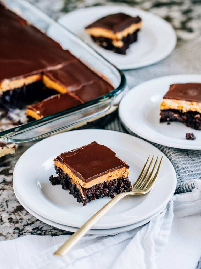 Plates of buckeye brownies ready to be served. Buckeye brownies are great for any party or gathering!