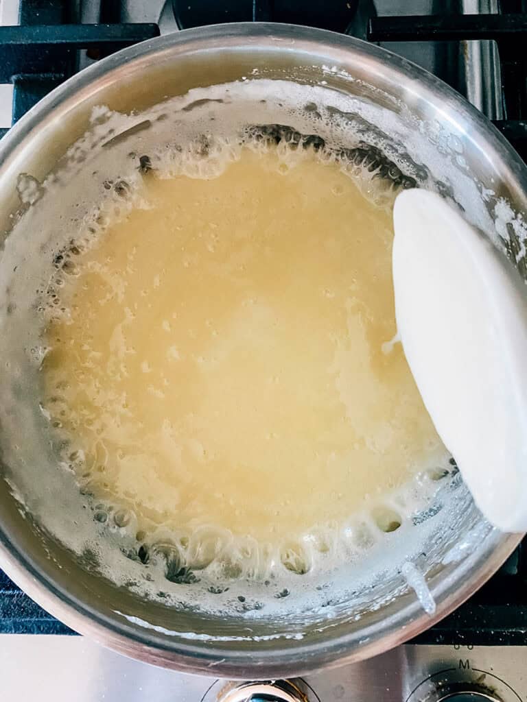 Boiling sugar mixture for one-minute frosting.
