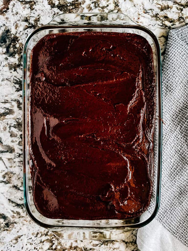 The one-minute frosting spread onto the warm zucchini brownies.