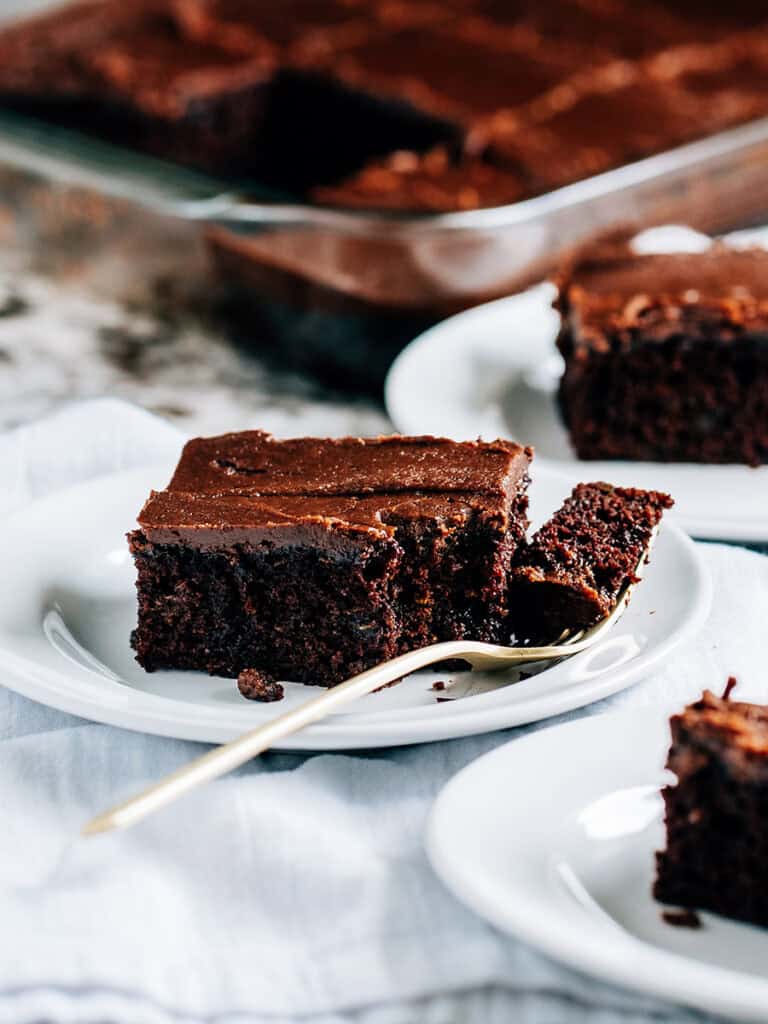 More frosted zucchini brownies ready to be served at family gatherings and holiday parties.